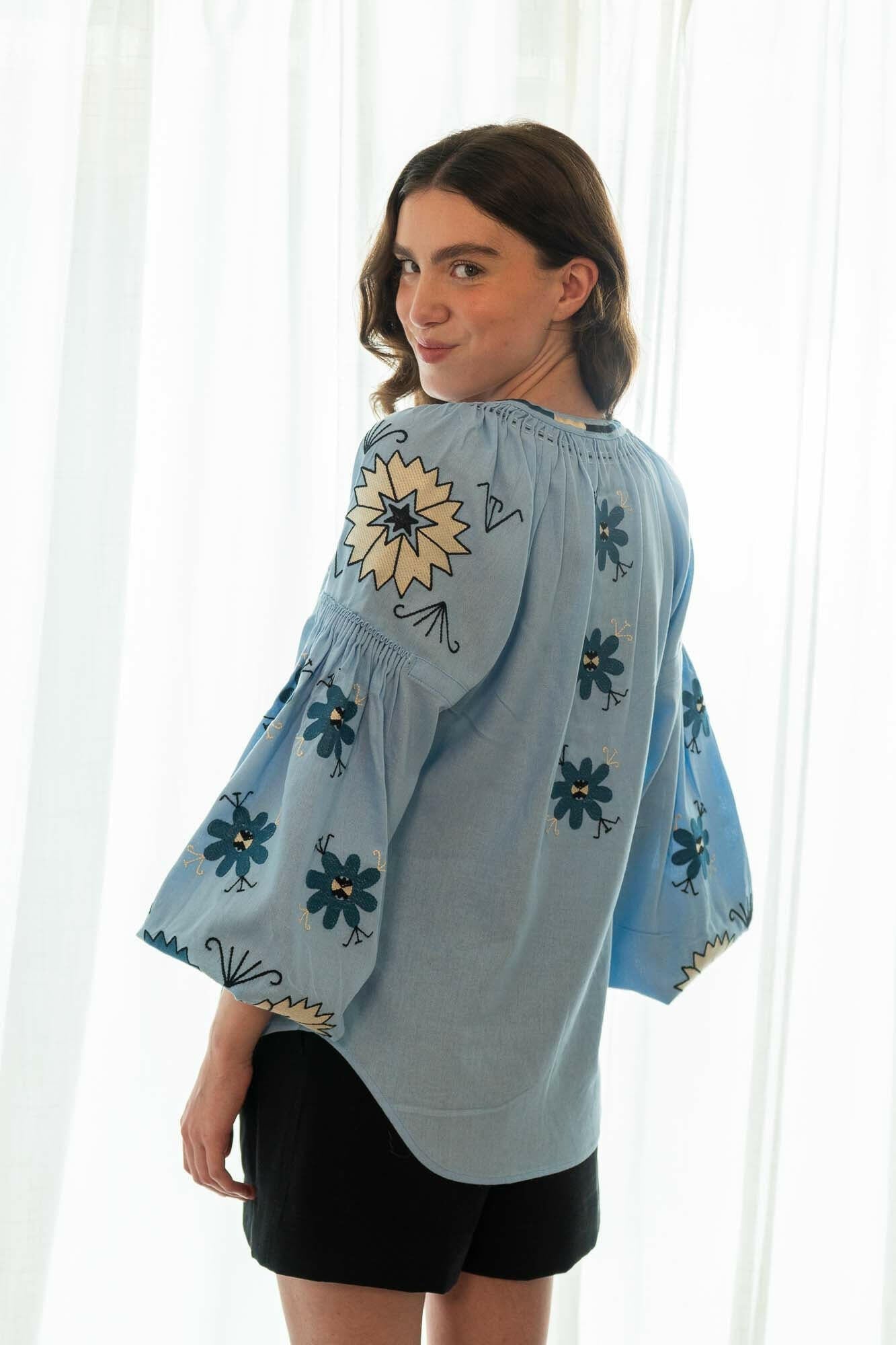 The Ivanna Blouse in Peaceful Sky — Embroidered Linen Blend Top by Amorrre – Luxury Resortwear, Embroidered Dresses & Kaftans.